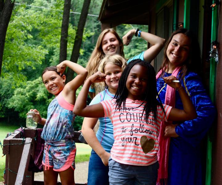 Girls outside of their cabin