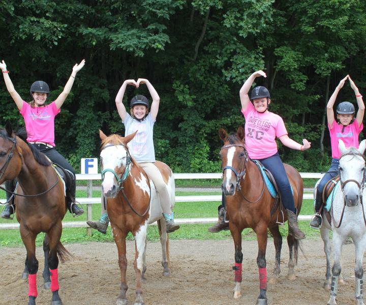 girls on horses spelling YMCA