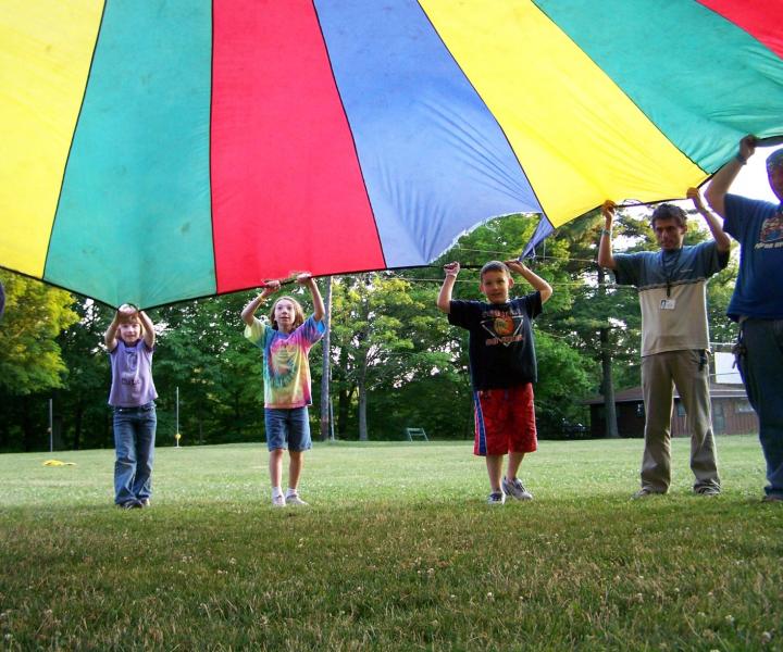 kids playing with parachute