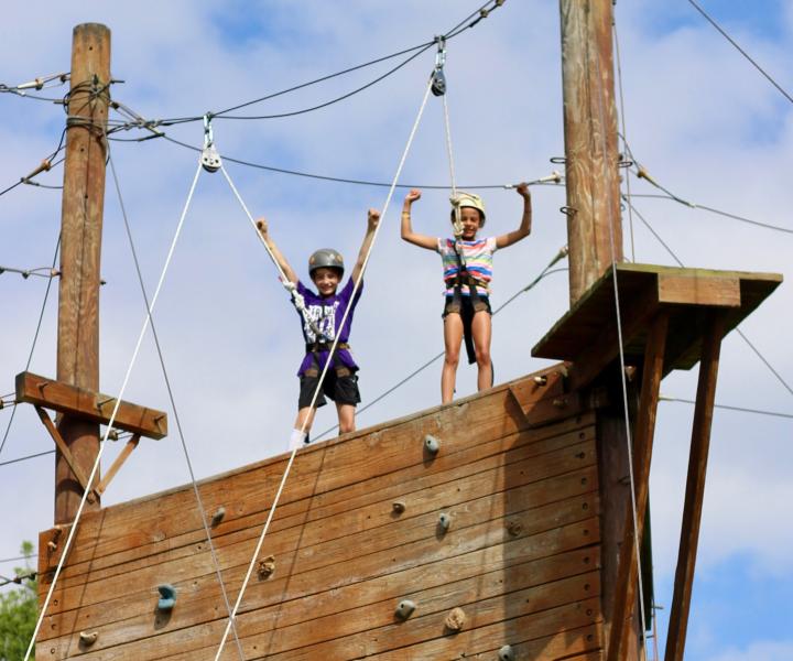 kids on top of rock wall