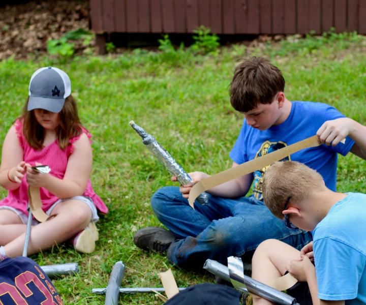campers building fake swords